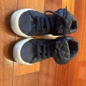 Tory Burch navy blue high top sneakers.